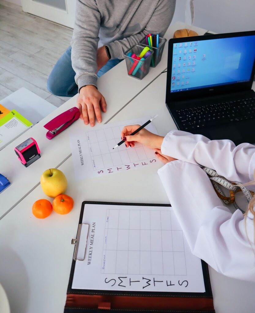 Dietitian creating a meal plan with a client