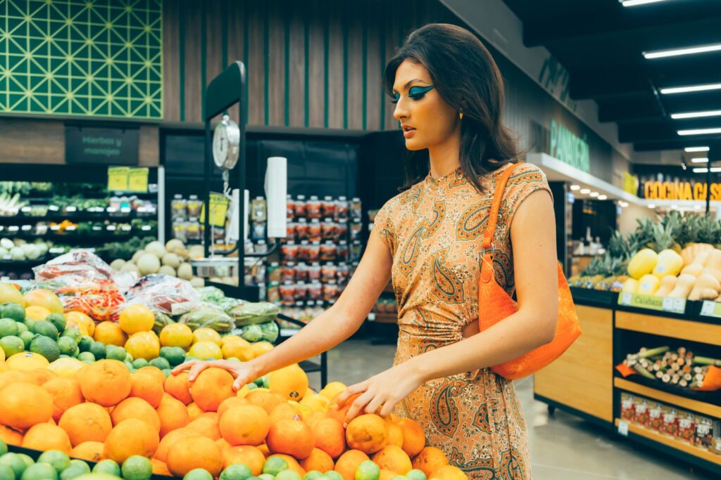 Woman choosing oranges at the supermarket