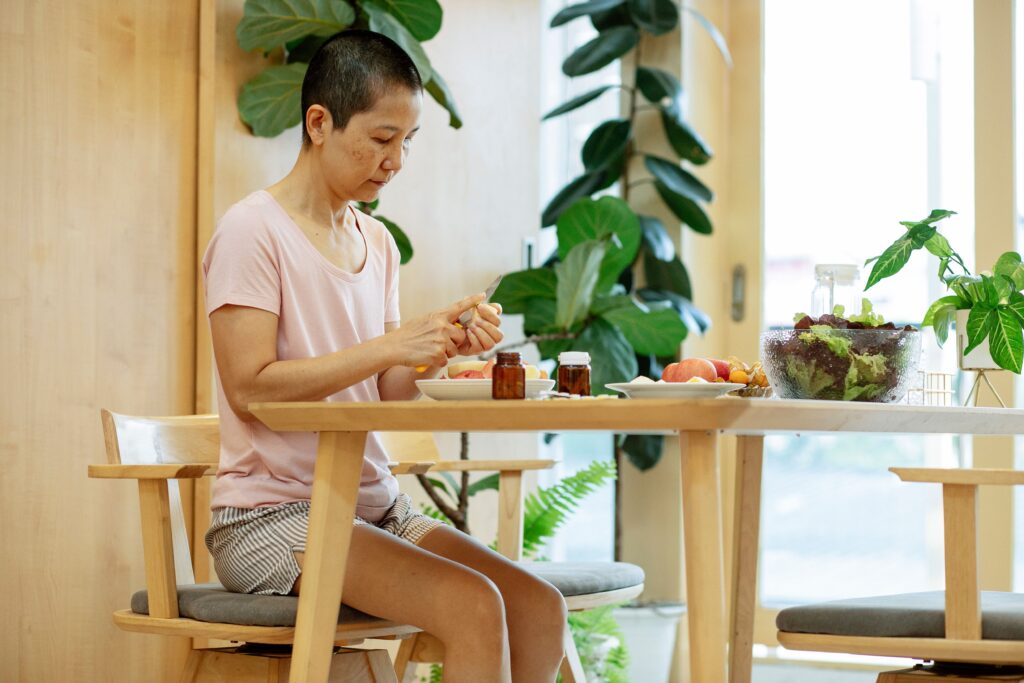 Woman sitting thoughtfully at a table
