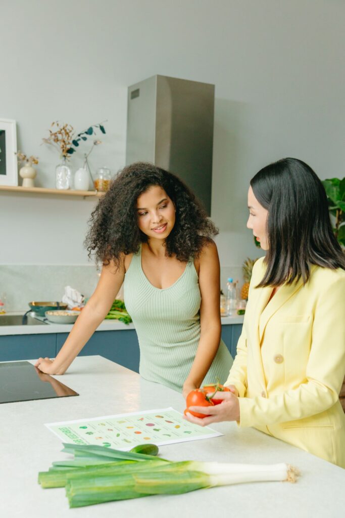 Dietitian and client talking in a kitchen